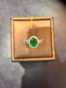 14k white gold with oval natural emerald and Diamonds