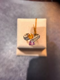 18k white gold ring with diamonds and 2 colored heart shaped stones