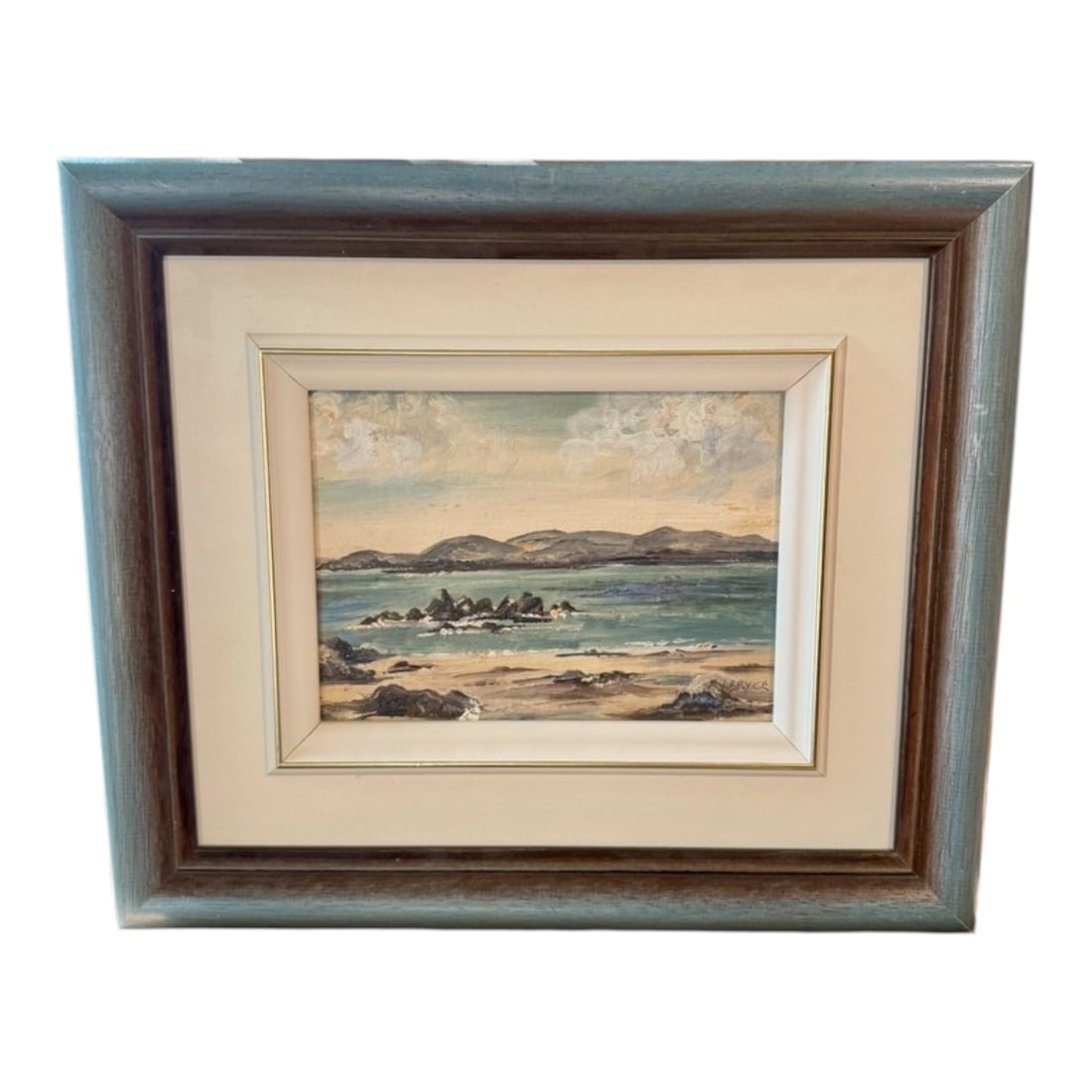 Coastal Landscape Oil Painting by E. I. Bryce: An atmospheric coastal landscape oil painting by E. I. Bryce, a 20th-century Irish Impressionist painter. This composition depicts a tranquil shoreline with rocky formations and distant hills beneath