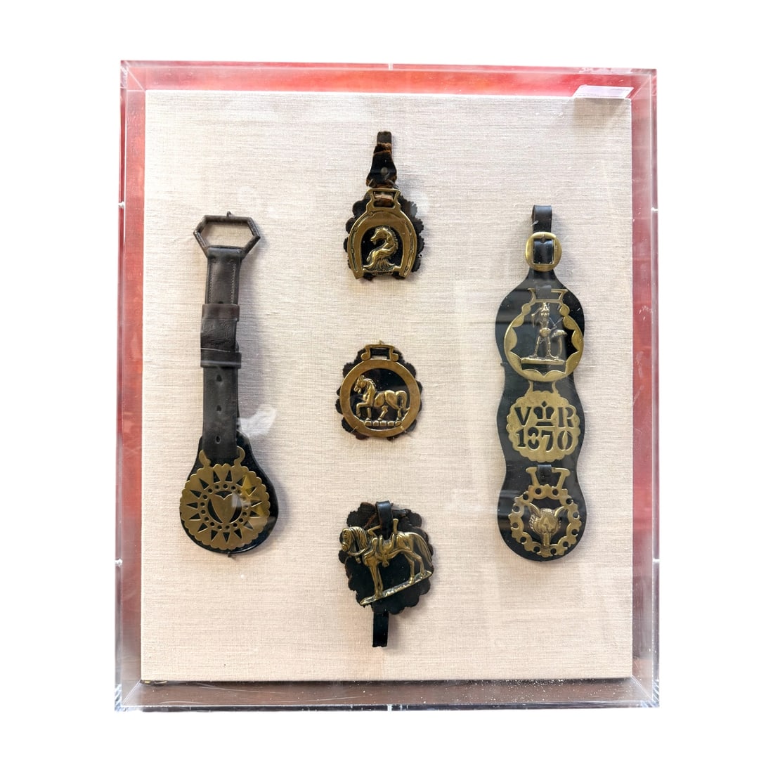 Framed Collection of Victorian Horse Brass Harness Medallions VR 1870?? (Victoria Regina): Decorative framed collection of antique English Victorian horse brass harness ornaments, traditionally used on horse tack for decoration and identification. The display includes several brass