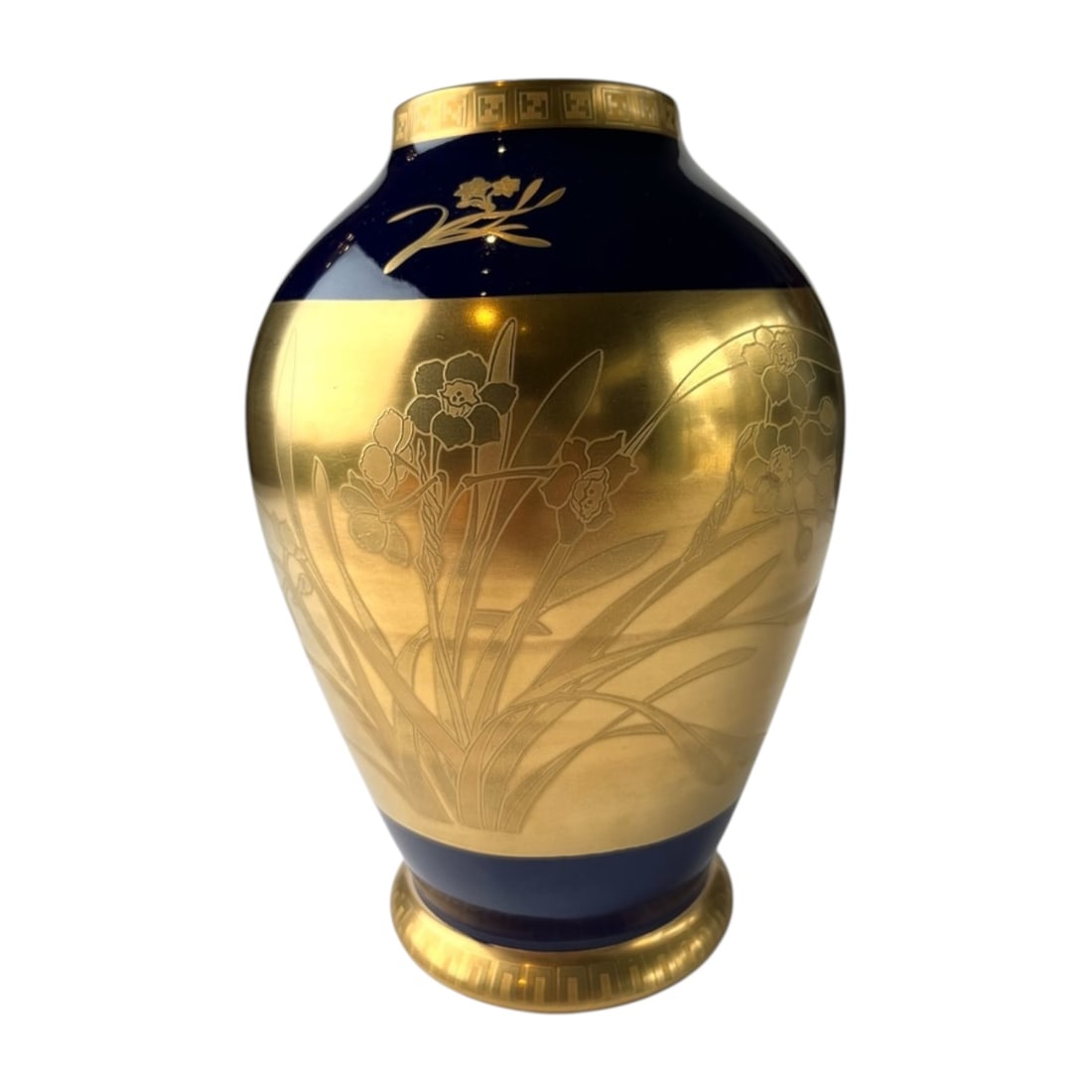 Vintage Japanese Gold Narcissus Porcelain Jar: This piece features a striking balance of vibration colbat blue glazing coupled with broad central gold glitter band. Etched lightly into the gold section are continuous, delicate narcissus blossoms a