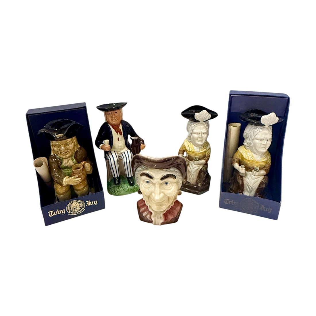 Five Vintage English Toby & Character Jugs: Collection of five vintage ceramic Toby and character jugs, including examples by Wood & Sons of Burslem, England, together with a Royal Copley character-form wall pocket or vase. The group comprises: