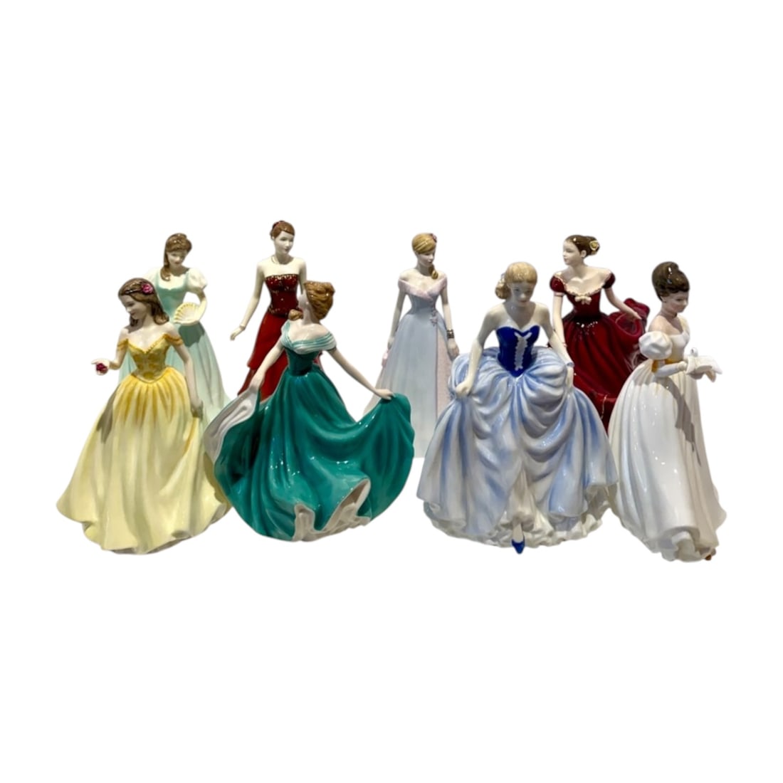 Eight Royal Doulton Porcelain Lady Figurines: Collection of eight Royal Doulton glazed porcelain lady figurines, each modeled in an elegant formal gown and individually hand decorated in shades of burgundy, green, blue, yellow, lavender, and whit