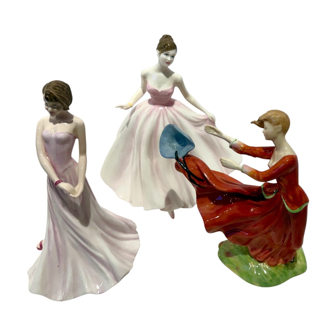 Three Royal Doulton Porcelain Lady Figurines: Collection of four Royal Doulton glazed porcelain figurines, offered together as one lot. The group includes:Royal Doulton Classics “Chelsea Jenny”, wearing a full pink-and-white evening gownA