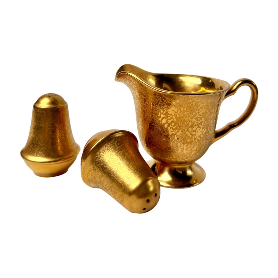 Vintage Wheeling Decorating Co. Gold-Encrusted Porcelain Creamer and Salt & Pepper Shakers: Three-piece porcelain table set by Wheeling Decorating Co. of West Virginia, consisting of a footed creamer and matching salt and pepper shakers. Each piece is finished in rich gold with an intricate 