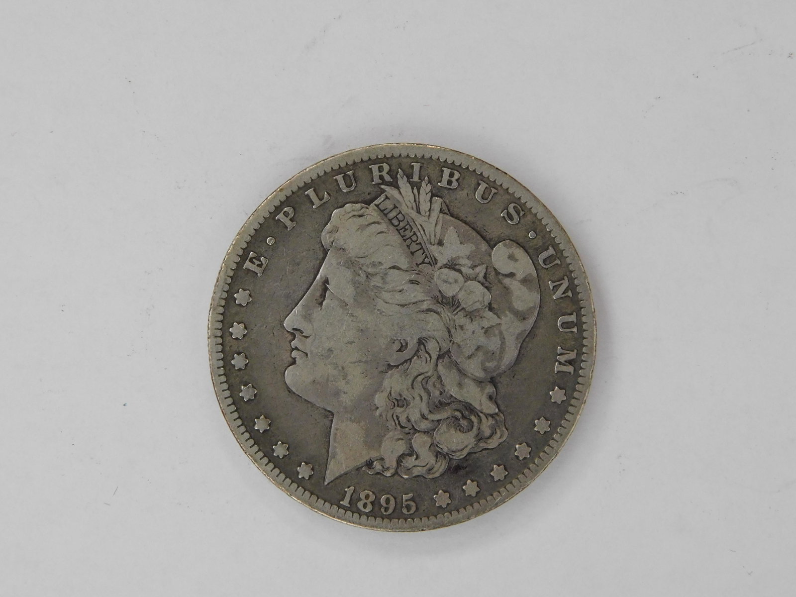 1895-O Morgan Dollar: Circulated, semi-key