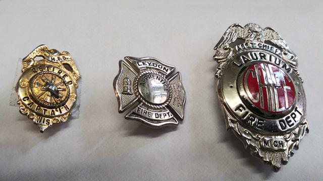 (3) BADGES / PINS: MANITOWOC WIS RETIRED FD CAPTAIN, LEYDON FIRE DEPT, ASST CHIEF LARIUM MI FIRE DEPT