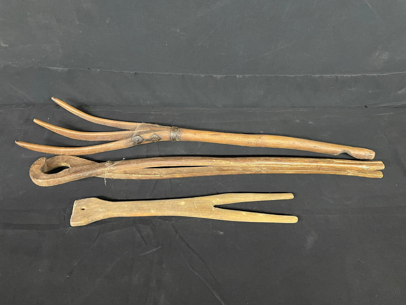 3pc. Primitive Wooden Hand Tools Including Fork With Steel Band/Reinforcement, Long Handle Tongs And: 3pc. Primitive Wooden Hand Tools Including Fork With Steel Band/Reinforcement, Long Handle Tongs And String Winding Style Hand Tool
