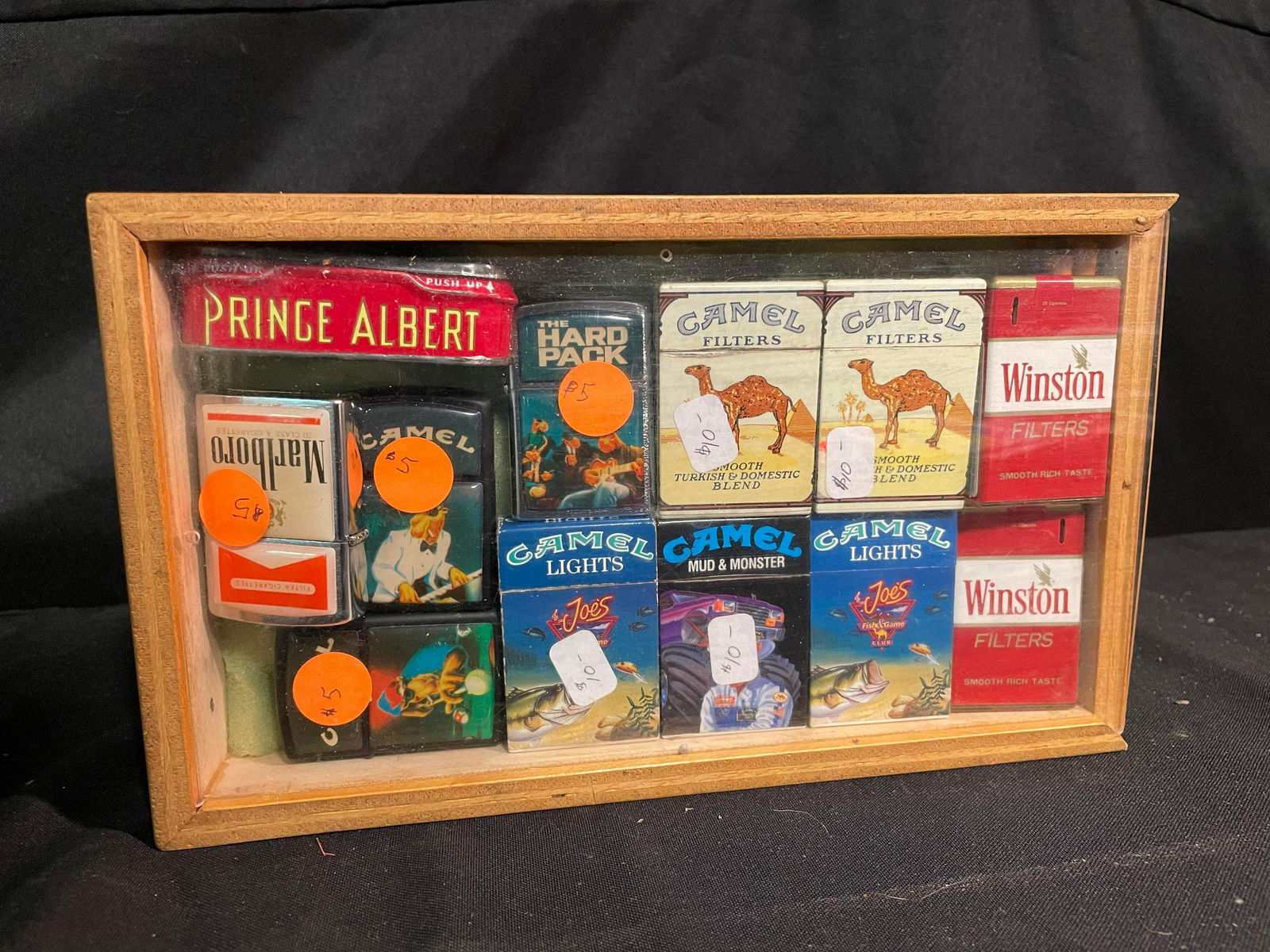 Display Case With Assorted Marlboro, Camel, Winston Zippo Lighters And Prince Albert Tobacco Tin (1 of 1)