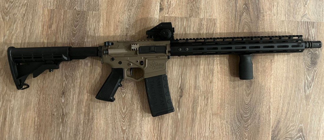 American Tactical Omni Hybrid Multi Cal 5.56 AR15 with front grip and laser sight: American Tactical Omni Hybrid Multi Cal 5.56 AR15 with front grip and laser sight