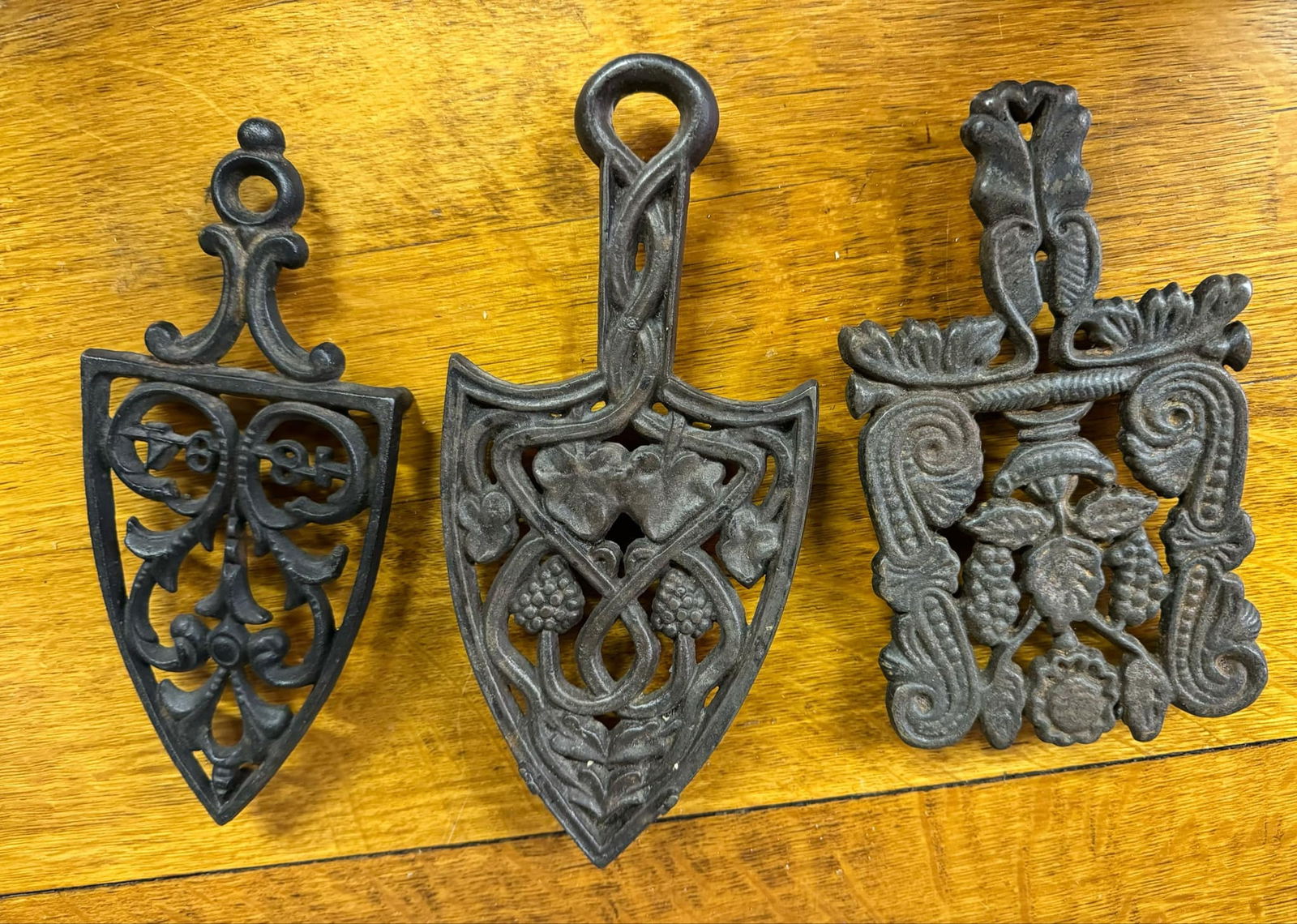 Trio of Antique Cast Iron Trivets: Trio of Antique Cast Iron Trivets