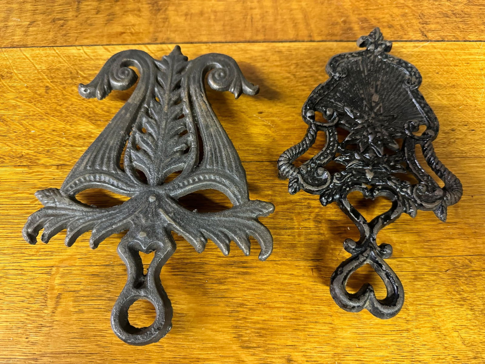 Two Antique Cast Iron Trivets: Two Antique Cast Iron Trivets