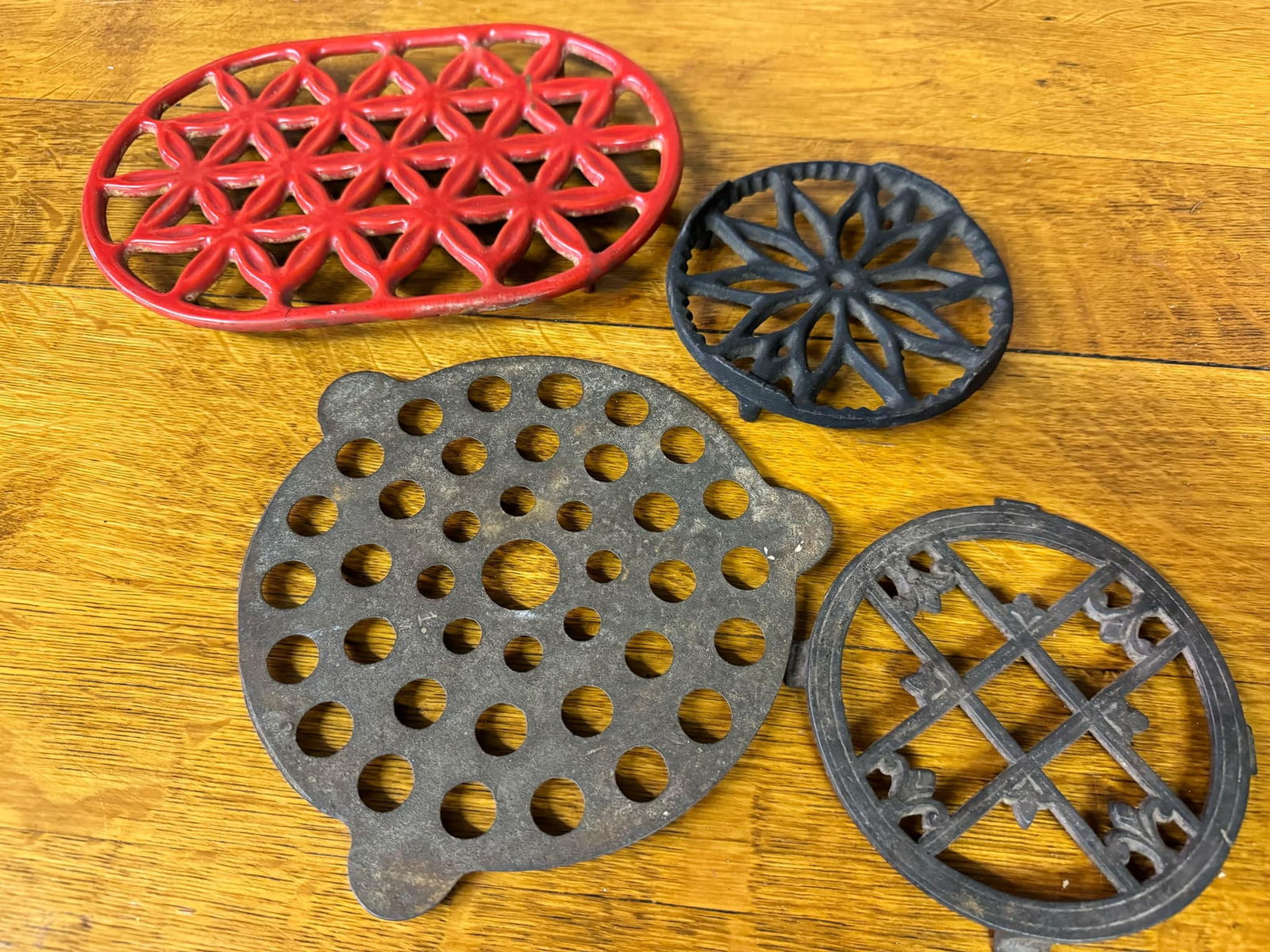 Four Antique Cast Iron Trivets: Four Antique Cast Iron Trivets