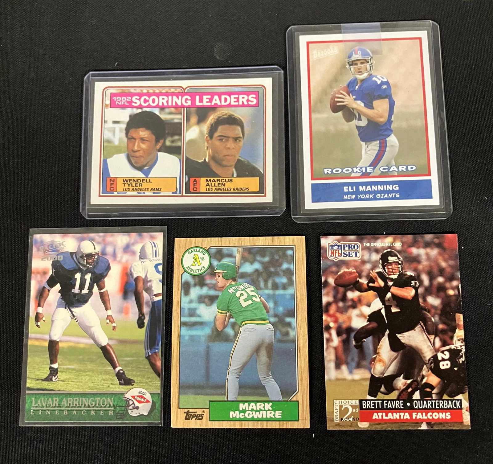 Assorted MLB And NFL Trading Cards Including Eli Manning Rookie Card, Mark McGwire And Brett Favre. (1 of 4)