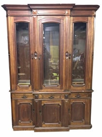Large Two Piece Victorian Walnut Bookcase With Carved Paneled Base And Glass Top Doors; Cabinet Is
