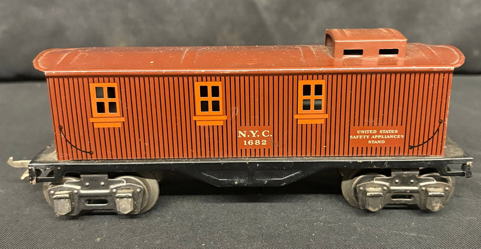 Lionel No. 1682 N.Y.C. Tin Brown Caboose 8": Lionel No. 1682 N.Y.C. Tin Brown Caboose 8"