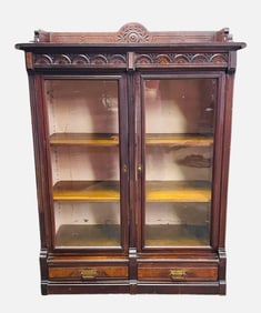 Walnut Victorian Two Door Bookcase With Carved Front And Top Gallery Has Two Glass Doors Over Two
