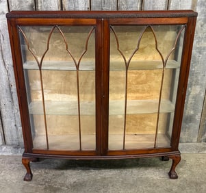 Vintage Two Door Walnut Glass Fronted Display Cabinet; Bow Fronted With Glass Shelves And Paw Feet.