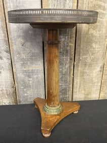 Vintage or Antique Round Pedestal Table featuring a White Marble Top with a Brass Gallery and Wooden