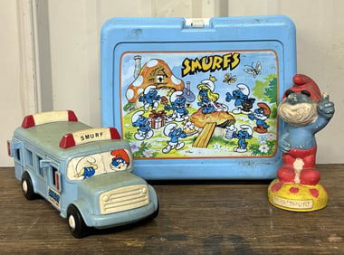 3pc. Smurfs Collectible Lot Including Lunch Pale (4"X9"X8"), Bus And Figure