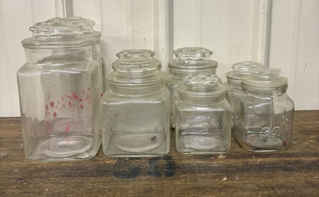 Set of Eight (8) Graduated Glass Canisters (Largest 4"X4"X10")