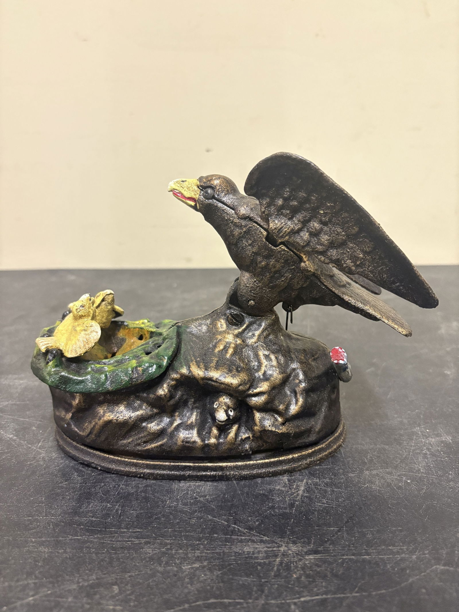 Eagle and Eaglets Cast Iron Mechanical Bank by Charles M. Henn for the J. & E. Stevens Company in: Eagle and Eaglets Cast Iron Mechanical Bank by Charles M. Henn for the J. & E. Stevens Company in the late 19th century - 8"x6"