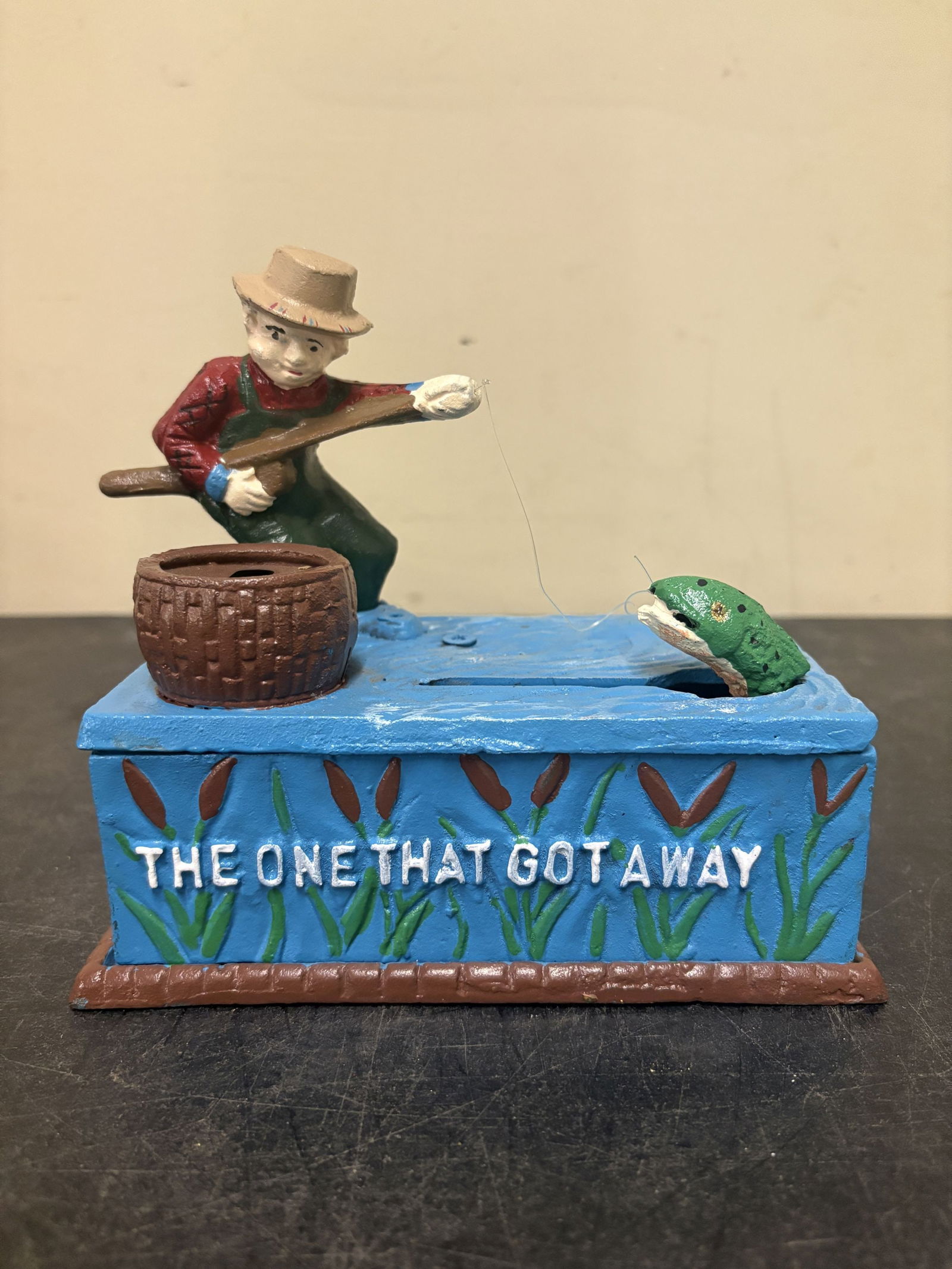 Cast Iron Mechanical Coin Bank known as "The One That Got Away" or the "Fisherman's Cast Iron Bank": Cast Iron Mechanical Coin Bank known as "The One That Got Away" or the "Fisherman's Cast Iron Bank" - 7"x7"