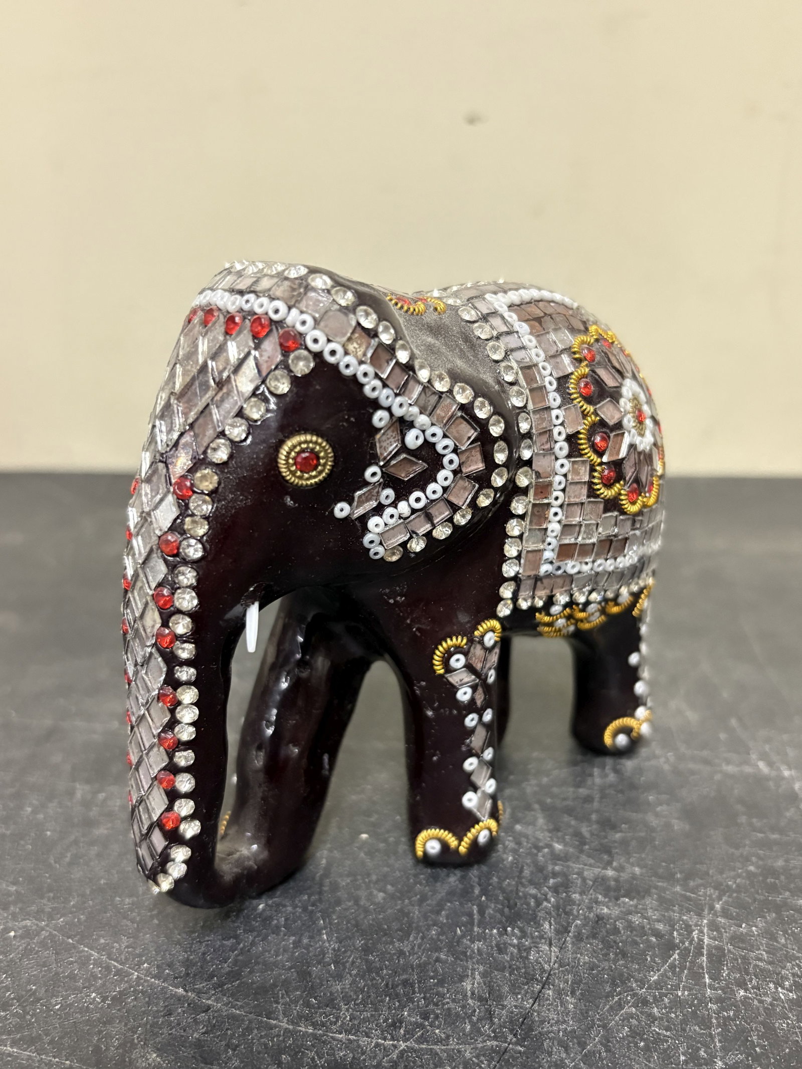 Handcrafted Kadam Wood "Majestic Indian Elephant" Sculpture, Painted Black with Golden Details and: Handcrafted Kadam Wood "Majestic Indian Elephant" Sculpture, Painted Black with Golden Details and Sparkling Accents in Clear White, Red. Lacquer-finished, Jeweled, and Mirrored Elephant Figure, Likel