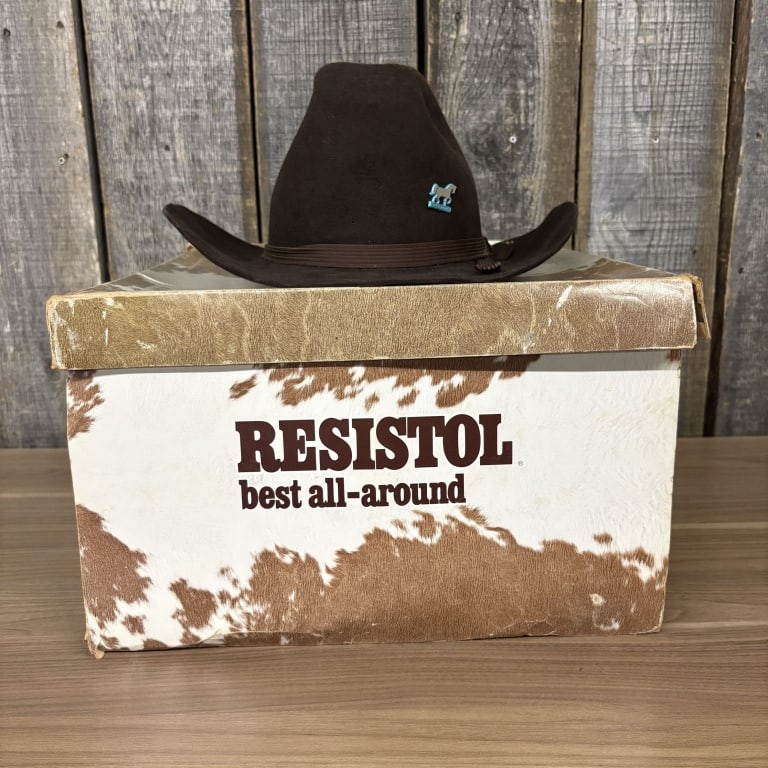 Vintage Resistol Cowboy Hat featuring a Distinctive Hat Pin and Presented in its original "best: Vintage Resistol Cowboy Hat featuring a Distinctive Hat Pin and Presented in its original "best all-around" Cowhide Print Box - 14"