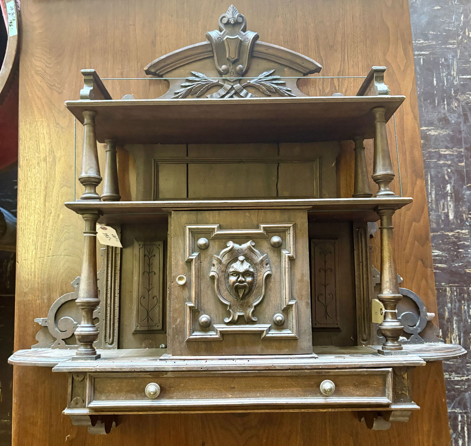 Antique German Walnut Hunt Cabinet, likely dating from the late 19th century featuring intricate: Antique German Walnut Hunt Cabinet, likely dating from the late 19th century featuring intricate carvings, including a central green man or figure - 36"x9"x