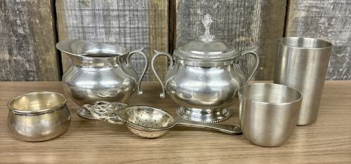 This Pewter Set Features a Sugar Bowl with Lid , a Creamer Dish and Tea Strainer, accompanied by: This Pewter Set Features a Sugar Bowl with Lid , a Creamer Dish and Tea Strainer, accompanied by additional silver-tone metal pieces - 4.5" - NOT AVAILABLE FOR SHIPPING, PICK UP OR TRANSPORT ONLY