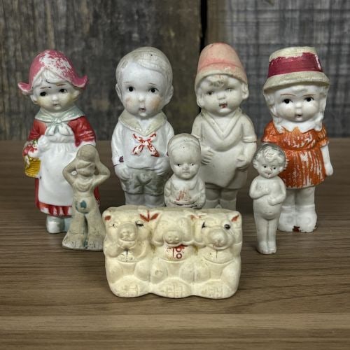 This Lot Features a Collection of Vintage Bisque Porcelain Figures, Commonly Known as "Frozen: This Lot Features a Collection of Vintage Bisque Porcelain Figures, Commonly Known as "Frozen Charlotte" or "Penny dolls," manufactured in Japan during the early-to-mid 20th century - 2"x4"