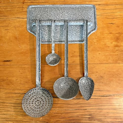 A Set of Vintage Gray Mottled Enamelware Kitchen Utensils with Wall Mounting Rack 12"X18": This set of domestic kitchenware is manufactured from stamped sheet metal finished with a mottled gray and white vitreous enamel, a style frequently referred to as graniteware. The set comprises a wal