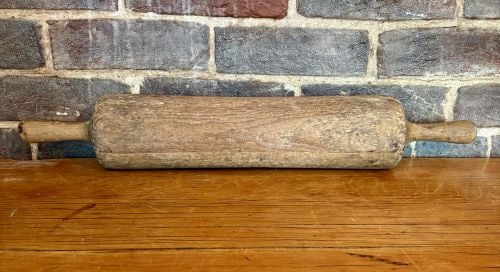 Antique Hand-Carved One-Piece Solid Wood Rolling Pin 4"X22": This vintage or antique rolling pin is hand-carved from a single solid block of wood, featuring a central rolling cylinder with integral, non-rotating handles. The construction indicates a traditional