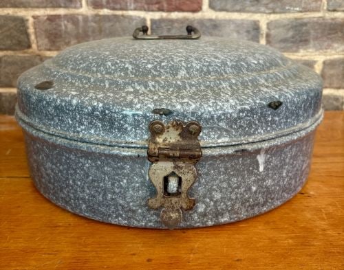 Antique Mottled Gray Enamelware Circular Storage Box 15"X7": A late 19th to early 20th-century circular storage container, possibly a bread box or hat box, constructed from stamped metal with a mottled gray and white vitreous enamel finish, often referred to as