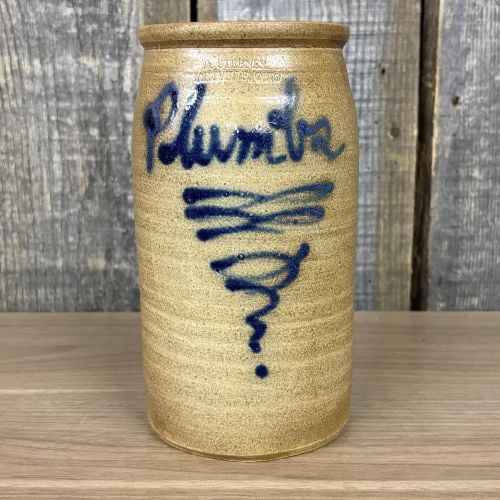 B. Stebner Hartville Ohio Salt-Glaze Stoneware Plumbs Jar: This salt-glazed stoneware jar was produced by B. Stebner in Hartville, Ohio. The vessel features a tall, cylindrical form with a slightly flared rim and exhibits prominent horizontal throwing rings f