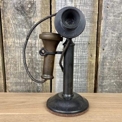 Antique Western Electric Model 323 Candlestick Telephone for AT&T: This is an antique manual candlestick desk stand telephone manufactured by Western Electric for the American Telephone and Telegraph Company (AT&T). The stand is constructed of metal with a black fini