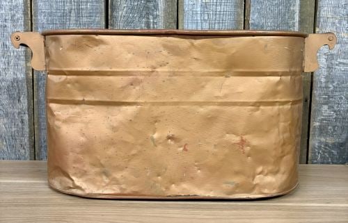 Antique Copper Wash Boiler Utility Tub with Wood Handles: This antique oval utility tub or wash boiler is fabricated from sheet copper, featuring vertical side seams and a rolled top rim. The body is reinforced with two horizontal ribs. Two ferrous metal han