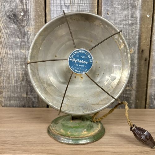 Vintage Cincinnati Victor Co Victor Electric Radiant Bowl Heater: This vintage electric radiant bowl heater is manufactured by The Cincinnati Victor Co. and branded as the Victor model. The unit features a parabolic metal reflector bowl supported by an adjustable gr