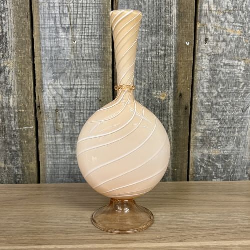 Large Peach Latticinio Art Glass Vase in the Murano Style: A hand-blown art glass vase featuring a flattened globular body, a tall tapering neck, and an applied flared pedestal foot. The body is constructed from peach-colored cased glass decorated with intern