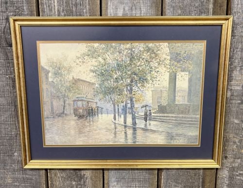 Paul Sawyier, Main Street Trolley, Limited Edition Photomechanical Lithographic Print: This photomechanical lithographic reproduction after an original watercolor by American artist Paul Sawyier (1865-1917) is titled Main Street Trolley. The work depicts a rainy street scene in Frankfor