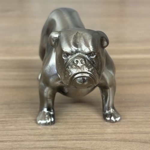 Vintage Mack Trucks Cast Metal Bulldog Mascot Figurine: A vintage cast metal figurine representing the English bulldog mascot for Mack Trucks. The item is constructed from cast metal with a polished metallic finish, likely chrome or nickel plating. The bul