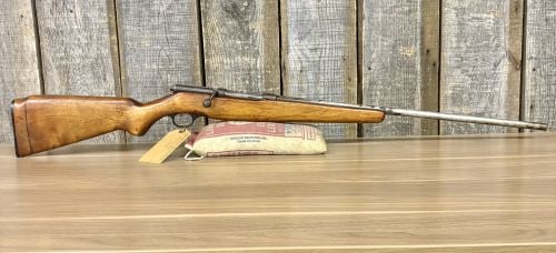 Western Auto Revelation Model 330 Bolt Action Shotgun .410 Gauge with 26 Inch Barrel: This is a single-shot bolt-action shotgun chambered in .410 gauge, marketed under the Western Auto Supply Company store brand. The firearm is equipped with a 26 inch barrel featuring a fixed front bea