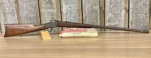 Winchester Model 1885 Low Wall Falling Block Rifle .32 W.C.F. with 28 Inch Barrel Antique: This is a Winchester Model 1885 Low Wall falling block single-shot rifle chambered for the .32 W.C.F. cartridge, also known as the .32-20 Winchester. The rifle is equipped with a 28-inch full octagona