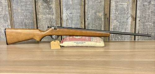Marlin Model 100 Single-Shot Bolt-Action Rifle .22 S/L/LR with 24 Inch Barrel: This Marlin Model 100 is a classic single-shot bolt-action rifle chambered to accept .22 Short, .22 Long, and .22 Long Rifle cartridges. It features a 24-inch blued steel barrel and a matching blued r