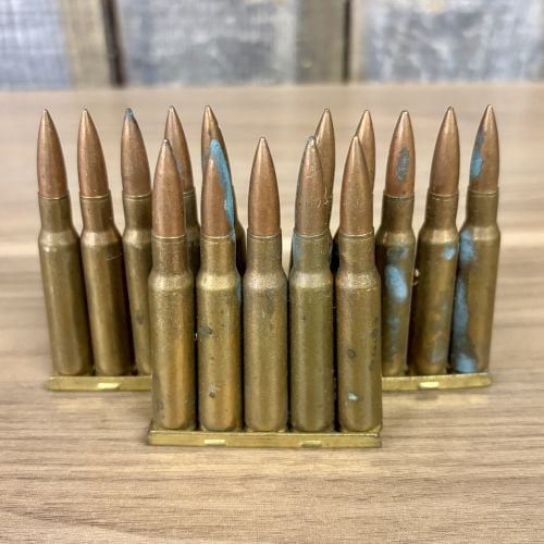 A Lot of 15 Pirotecnico de Sevilla 7.92x57mm Mauser Cartridges 1945: This lot consists of 15 rounds of centerfire rifle ammunition, chambered in 7.92x57mm (8mm Mauser), organized on three five-round brass stripper clips. The cartridges feature brass casings and copper-