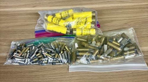 A Lot of Assorted Ammunition including 20 Gauge Shotgun Shells, .38 Special, and .22 Caliber Rimfire: This lot consists of an assortment of small arms ammunition organized into three clear plastic bags. The first bag contains 12 yellow 20 gauge shotgun shells, specifically Remington Shur Shot Dove loa