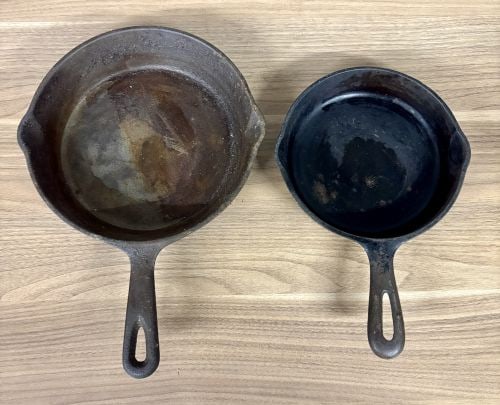 A Pair of Vintage American Cast Iron Skillets: This lot consists of two vintage American cast iron skillets of different sizes. The larger skillet measures approximately 8 inches in diameter and features an inset heat ring on the base with a teard