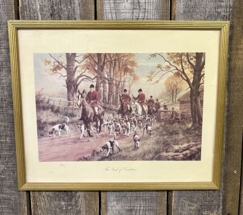 After George Wright, The Pink of Condition Framed Fox Hunting Print: This framed print is an offset lithograph titled The Pink of Condition, after the original work by George Wright. The scene depicts a traditional British fox hunt, with several huntsmen dressed in red