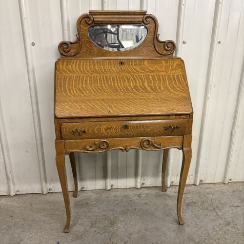 American Golden Oak Slant-Front Secretary Desk with Beveled Mirror Crest: SHIPPING NOT AVAILABLE, FOR PICK UP OR TRANSPORT ONLY - This is an American Golden Oak slant-front secretary desk, often referred to as a lady's desk. The piece is constructed from quarter-sawn oak, d